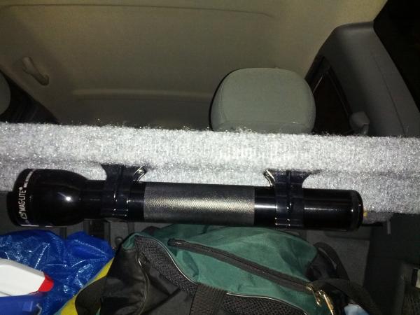 3 d-cell Maglite mounted to bottom of cargo rack.