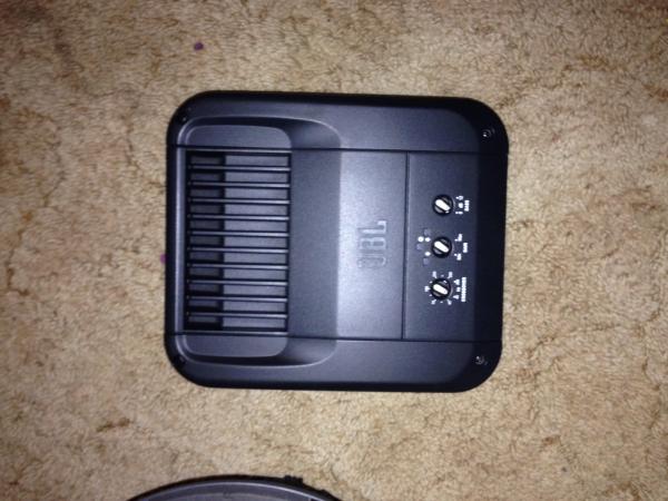 770W JBL GTO amp
(Nice power, and fits under the rear seat)
