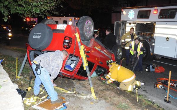 a New Jersey woman is extricated after being struck by another vehicle causing this KJ rollover