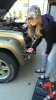 Sarah wrenching on the Jeep.jpg