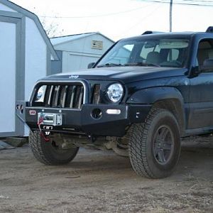My 05 KJ Renegade with an ARB Bumper and a Warn M8000 hanging off the front end.