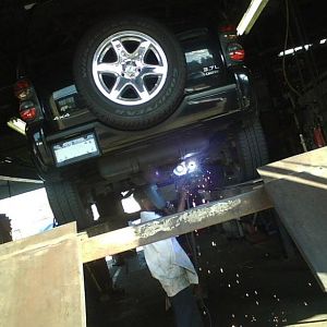 At muffler shop, installing my Flowmaster 50 SUV series