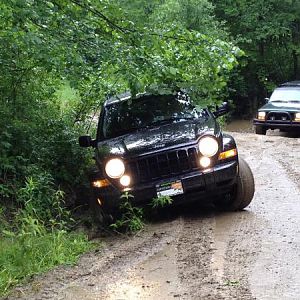 Stuck
I tried to follow some experienced Jeepers through the mud and ended up slipping off the road.  So much for "street tires".