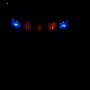 costom head lights i made blue led's and also million color ledglow lights in grill along with eye brows