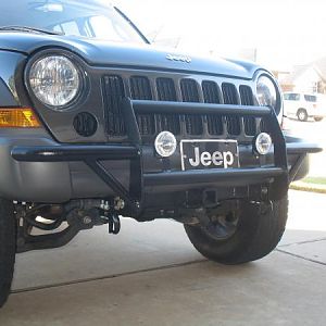 Trimmed front bumper,  fabricated the brush guard with built in tow hooks and also fabricated the front tow receiver.  All out of scrap steel.