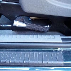 Maglite mini mounted to driver's side seat.