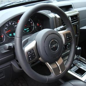 2012 Jeep Liberty Ltd Jet Edition with Dark Slate Leather and silver-grey woodgrain interior.