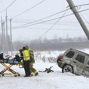 Slippery roads put this woman into a Liverpool, NY power pole