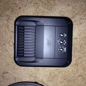 770W JBL GTO amp
(Nice power, and fits under the rear seat)