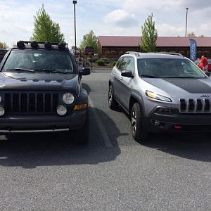 2" lifted KJ parked next to a Cherokee Trailhawk.