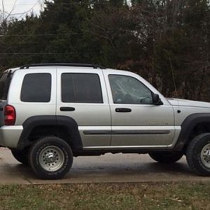 image 02 Sport. Rebuilt engine/2 1/2" lift/bumpers and flares from a Limited. I sanded nicks and scratches out of the flares and shot them flat black.