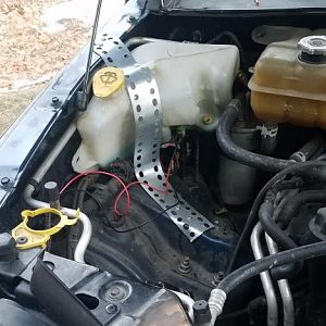 relocated washer fluid bottle