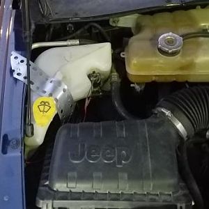 relocated washer fluid bottle
