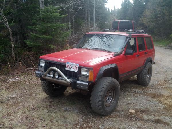 1997 jeep cherokee sport I custum built a 6in suspension lift for it with a full roll cage and a snorkel. Eran 33in 12 plie tires with 5 psi in them g