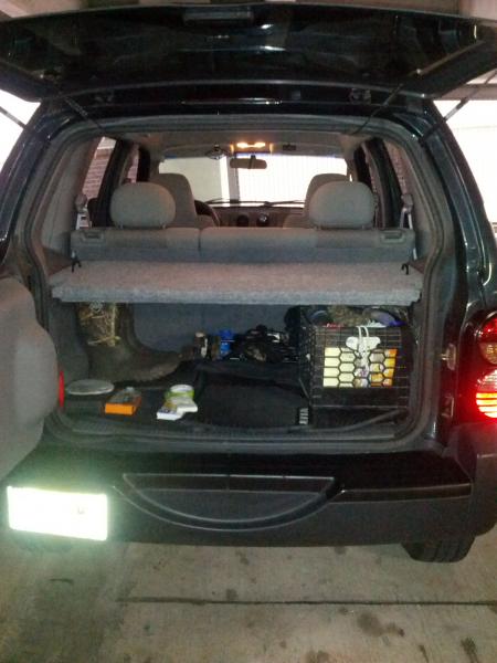 Homemade cargo rack with door open.