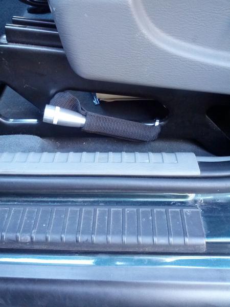 Maglite mini mounted to driver's side seat.