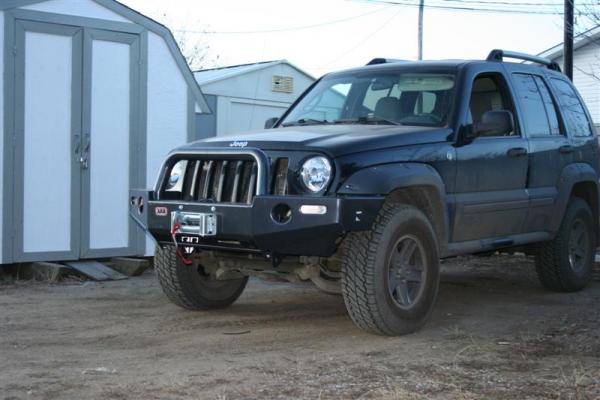 My 05 KJ Renegade with an ARB Bumper and a Warn M8000 hanging off the front end.