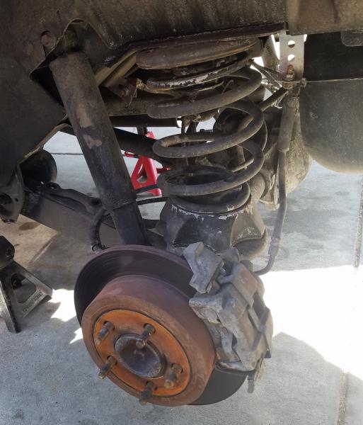 Old rear spring with daystar spacer lift and old shock