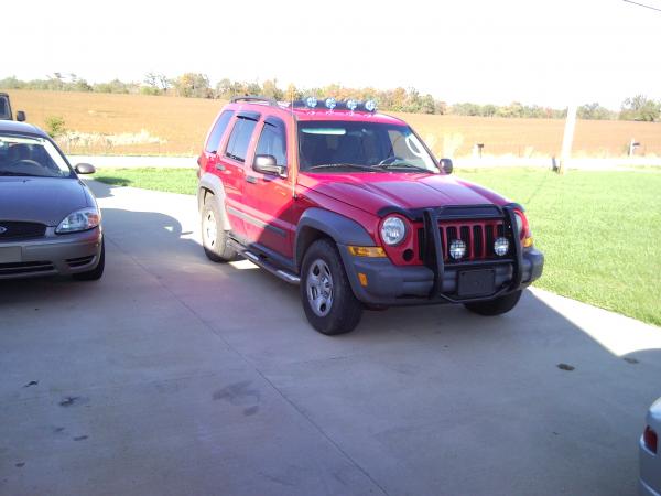 Pre-lift, showing the added light bar and brush guard.