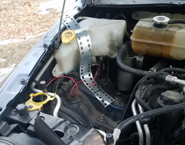 relocated washer fluid bottle