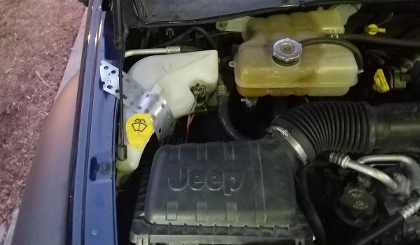 relocated washer fluid bottle