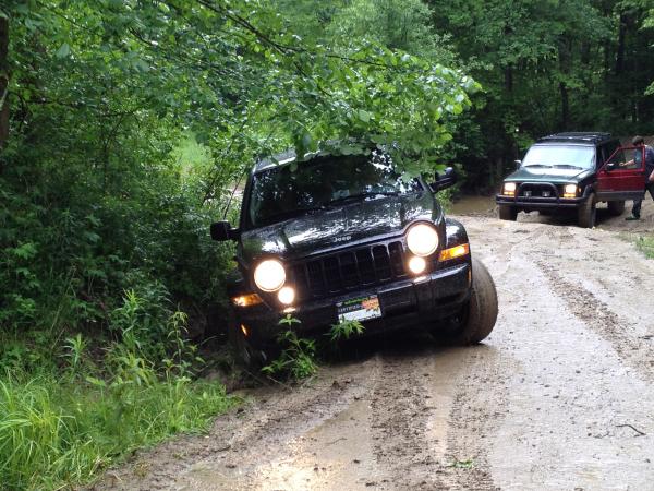 Stuck
I tried to follow some experienced Jeepers through the mud and ended up slipping off the road.  So much for "street tires".