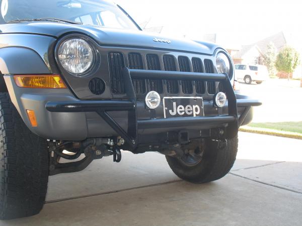 Trimmed front bumper,  fabricated the brush guard with built in tow hooks and also fabricated the front tow receiver.  All out of scrap steel.