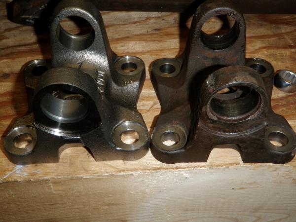 U Joint Flange Buggered up one on right.  See Crack at C clip channel.  $110 mopar.