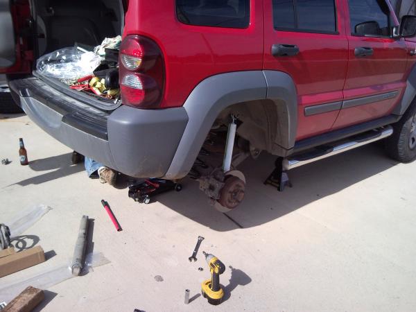 Working on the rear axle springs and shocks.